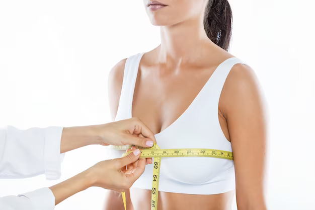 تجميل الثدي 1 1695123357doctor with measure tape measuring size patient s breast 1301 7531