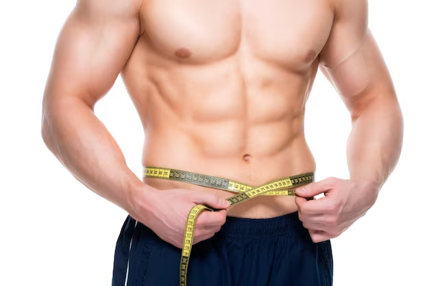1696251069young handsome man with muscular torso uses measuring tape isolated white wall 186202 8878